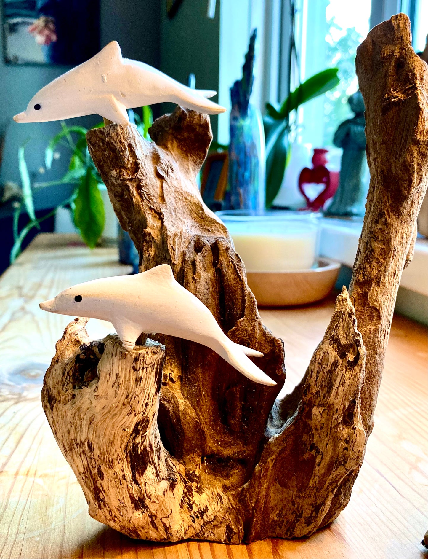Dolphins on teak wood