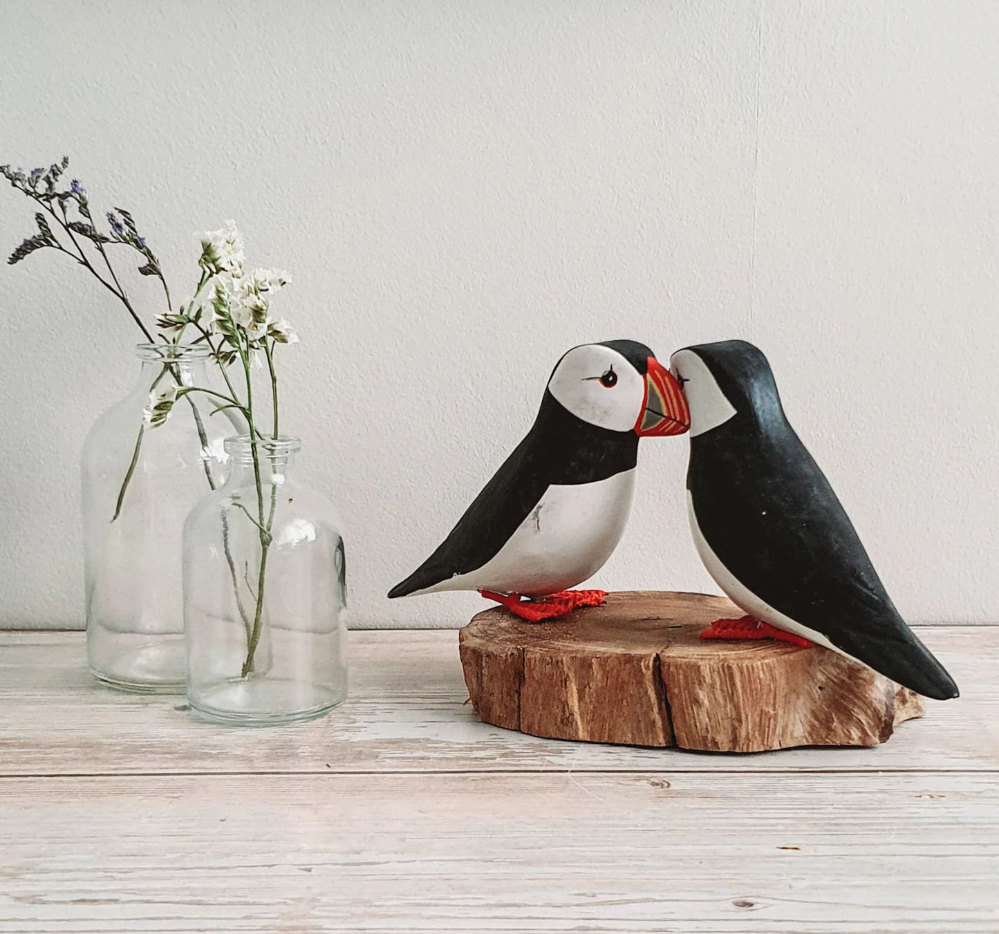 2 Wooden Puffins on a Plinth